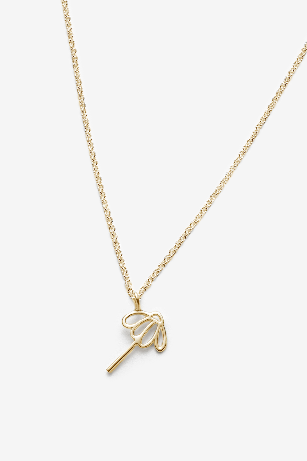 Gold chain necklace with a sunflower pendant on a white background